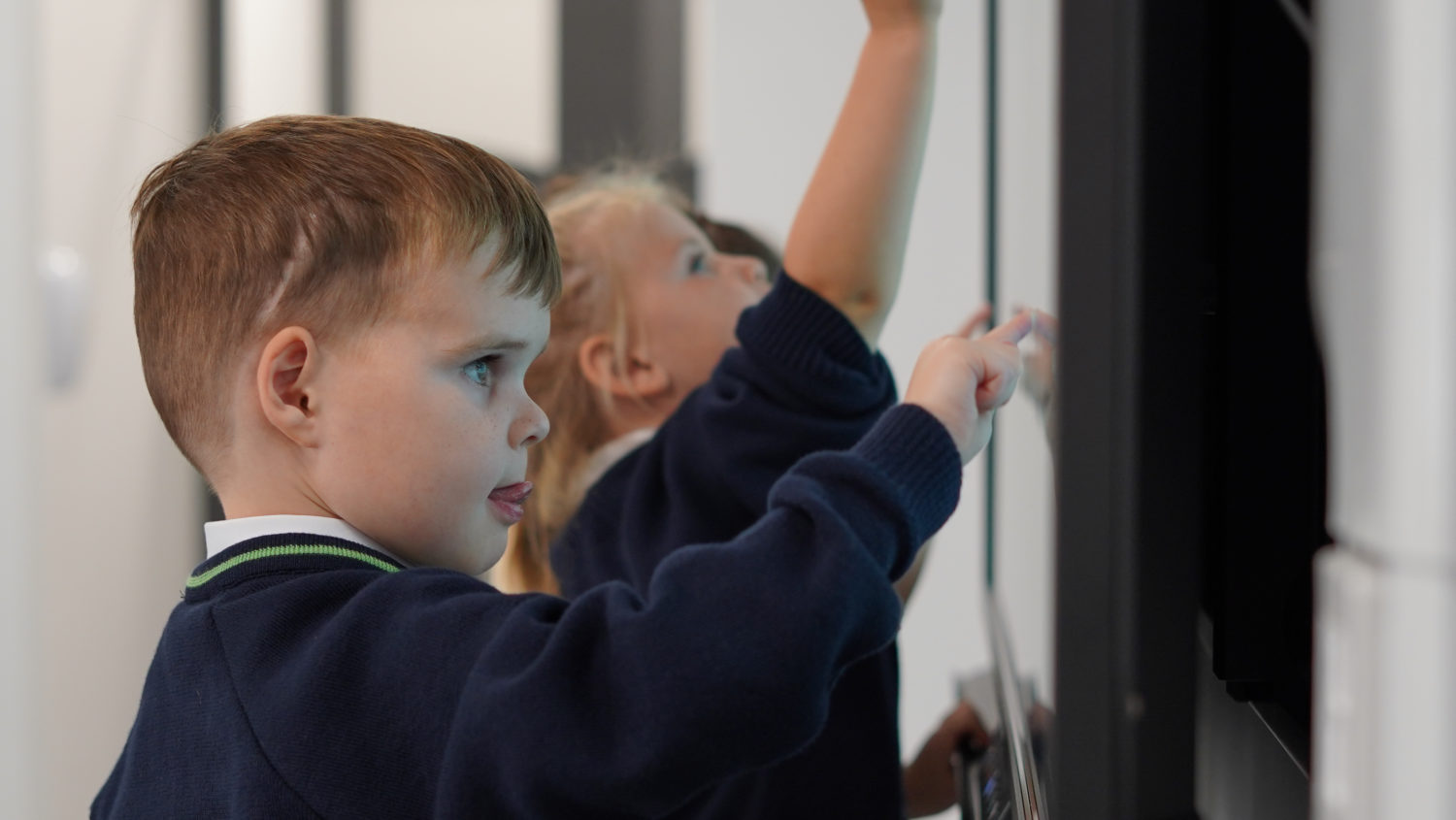 Children playing on the interactive whiteboard